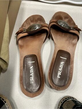 Prada Tan Leather Slide Sandals with Silver-Tone Medallion